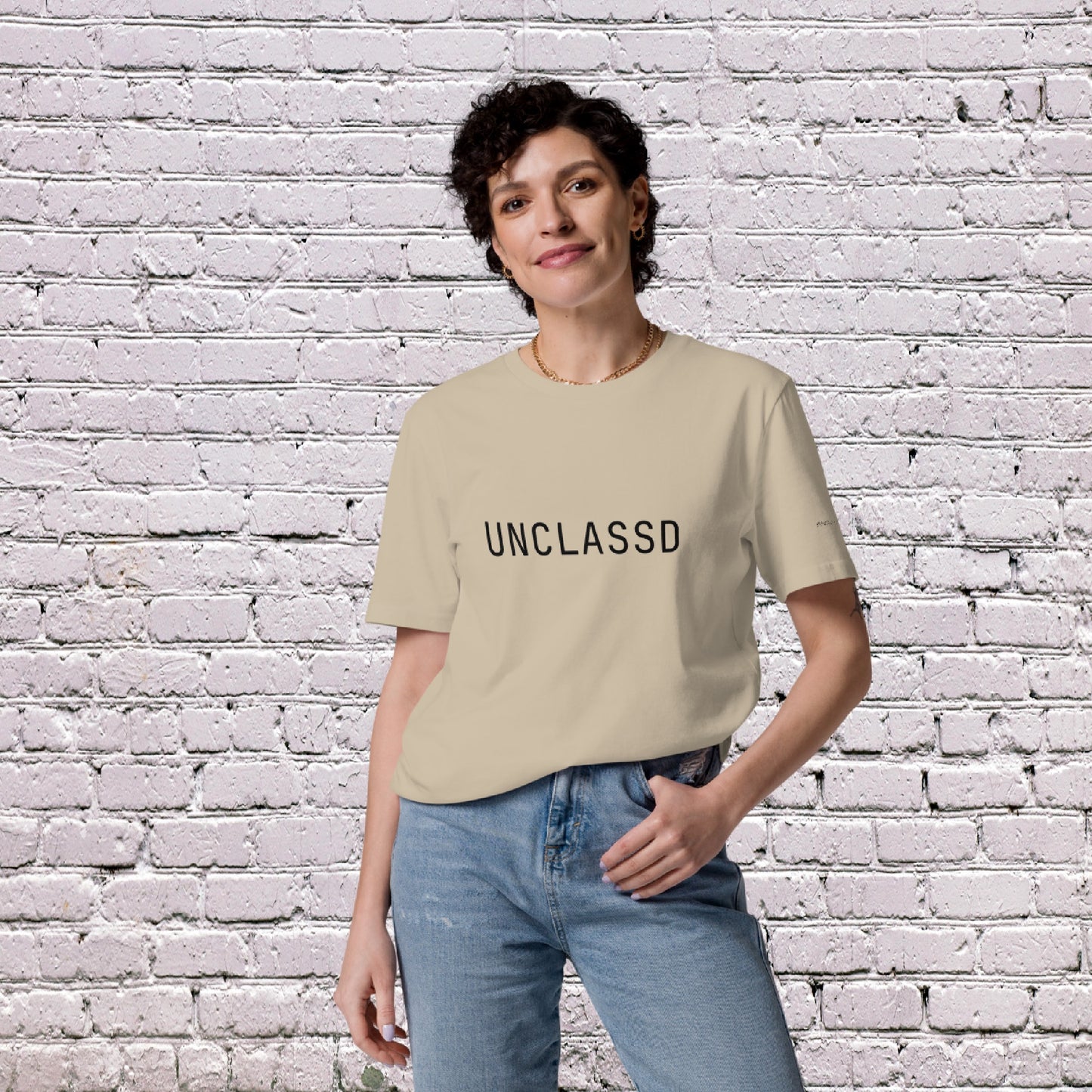 Female Model wearing UNCLASSD CORE Sand Tee during dance or rollerskate flow practice - front