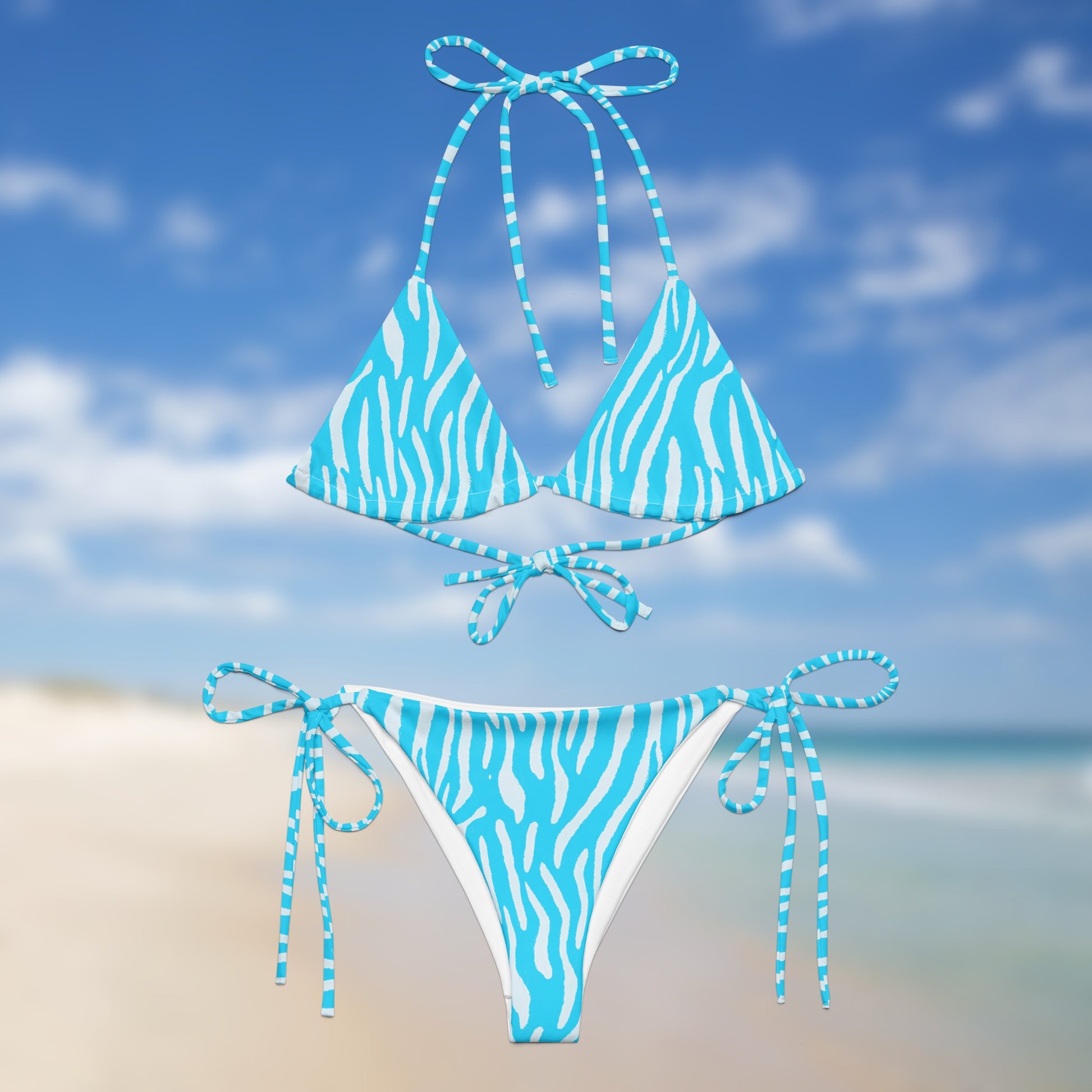 Front neon blue zebra triangle bikini with adjustable tie straps by Unclassd.