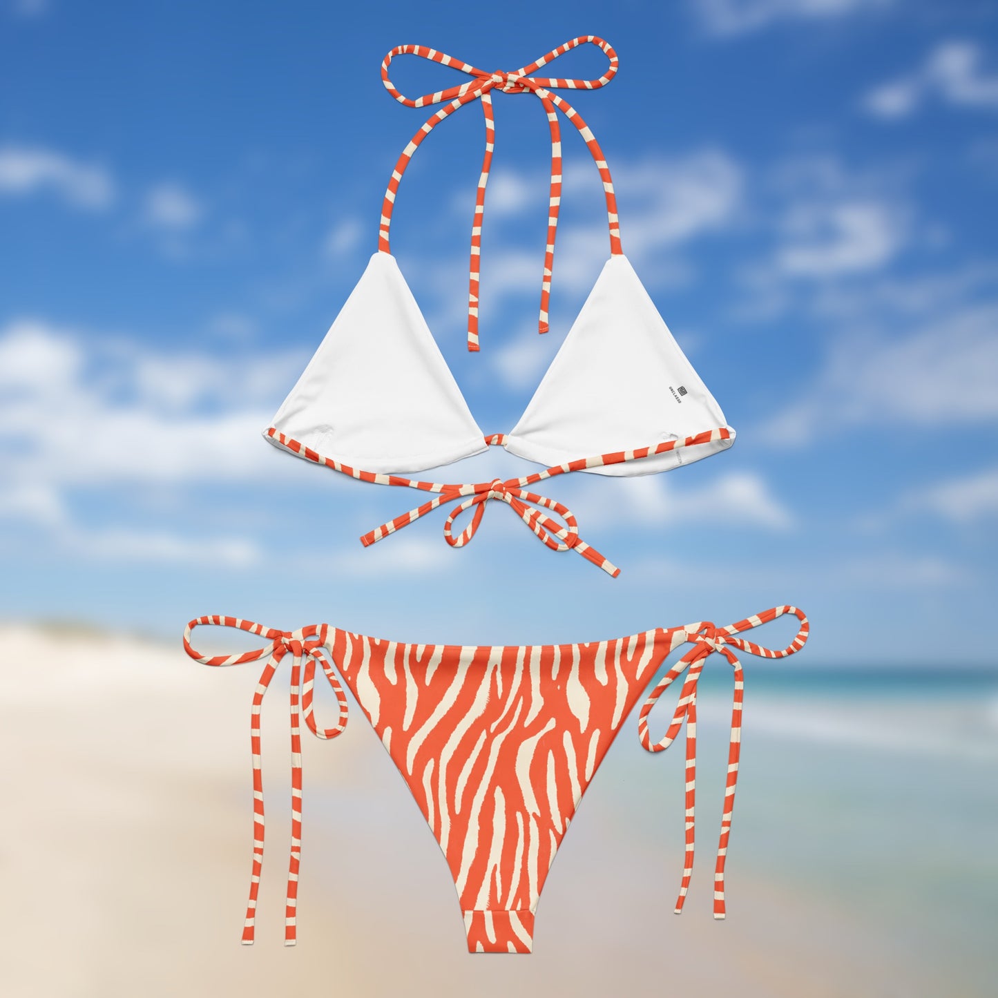 neon orange zebra triangle bikini with adjustable tie straps and matching side-tie bottoms by Unclassd. Back