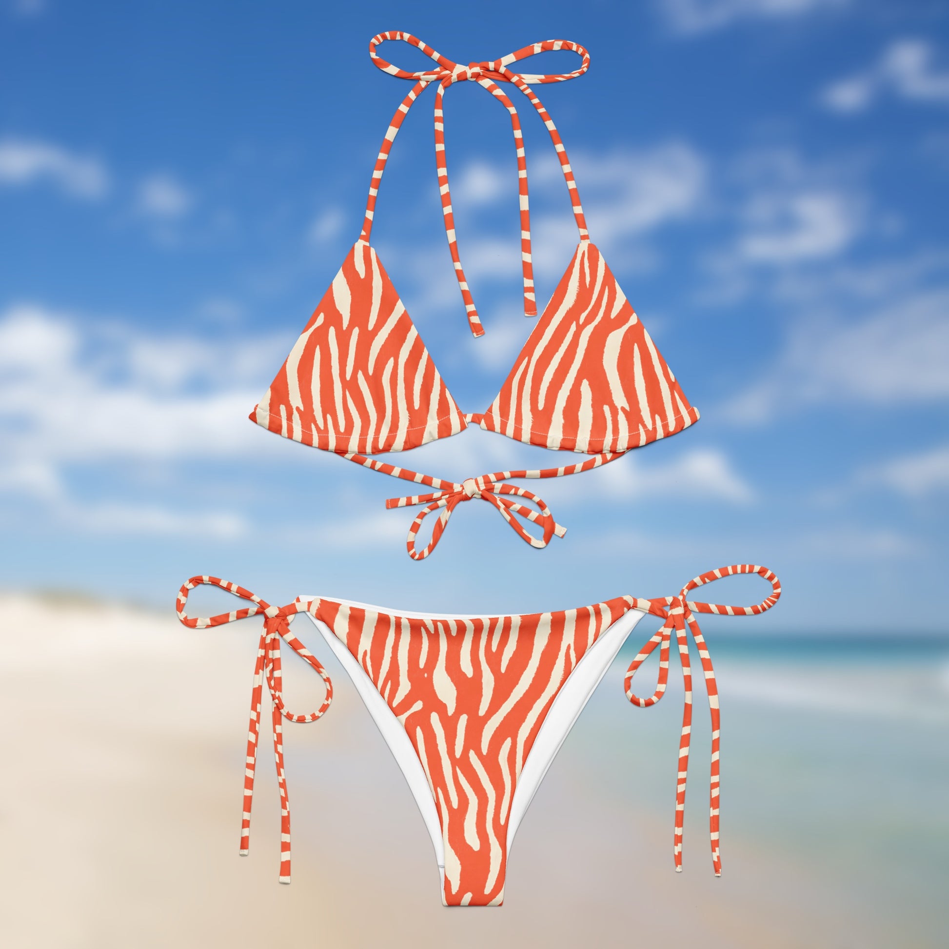 neon orange zebra triangle bikini with adjustable tie straps and matching side-tie bottoms by Unclassd.Front