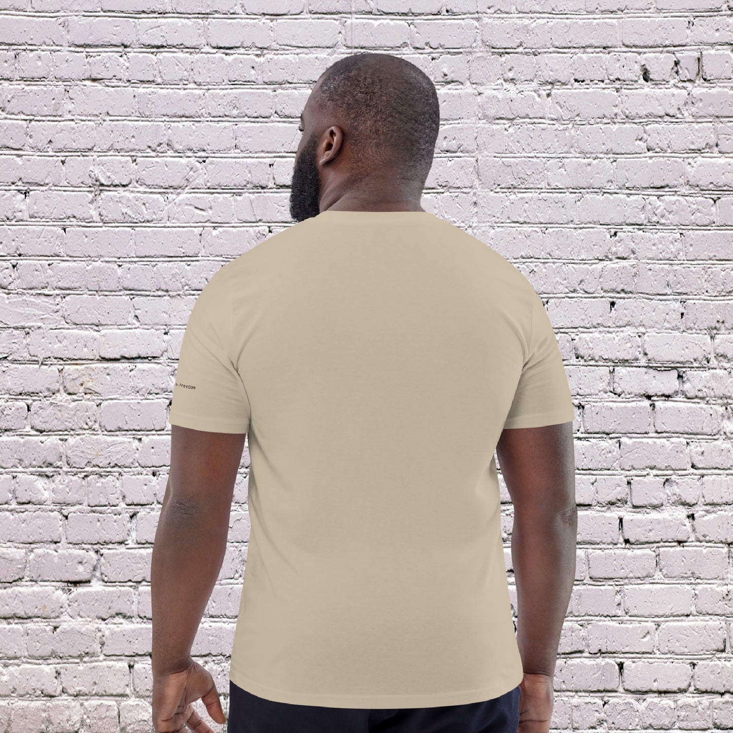 Male Model wearing UNCLASSD CORE Sand Tee during dance or rollerskate flow practice - back 