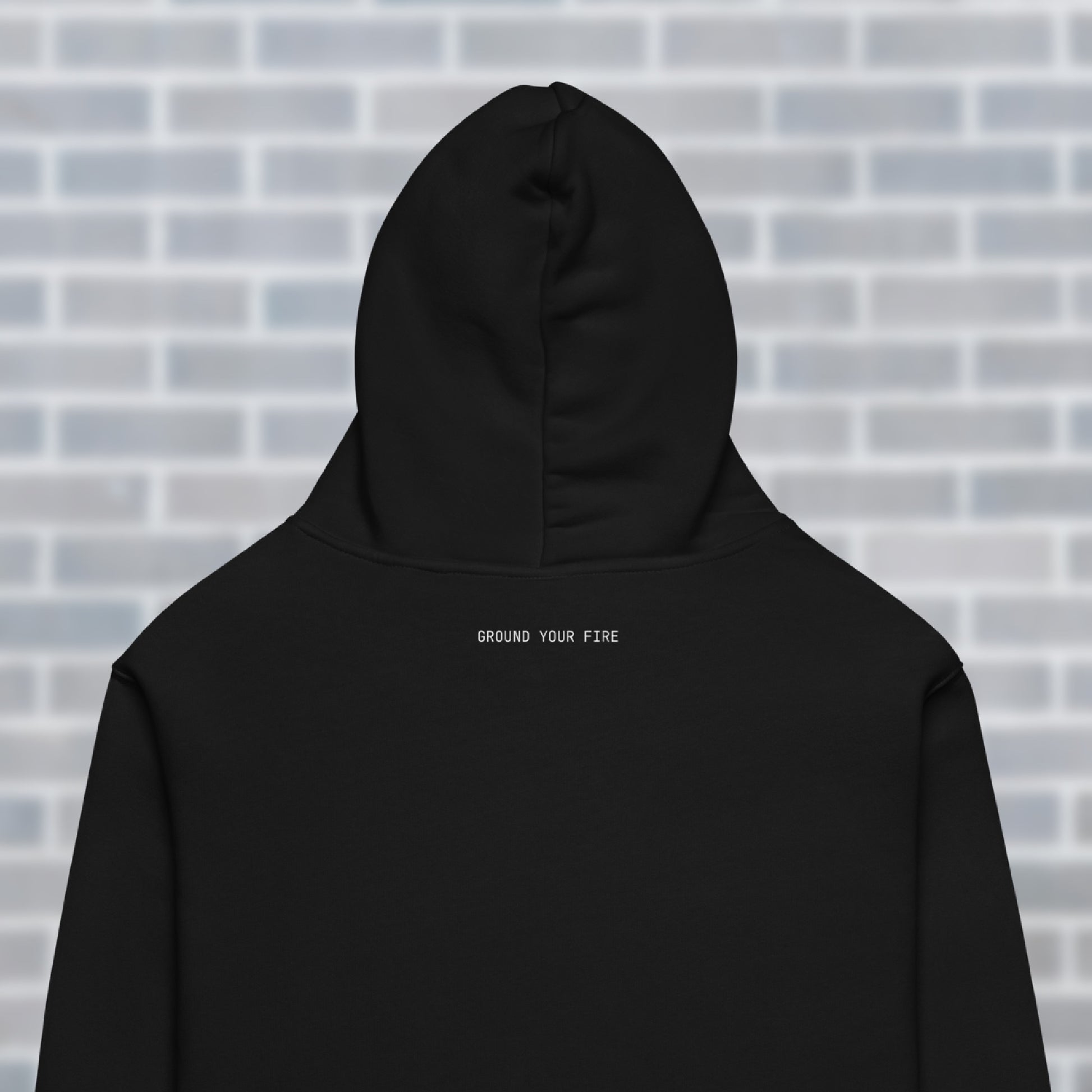 Close up of “Ground Your Fire text” printed at back neck of UNCLASSD CORE oversized hoodie