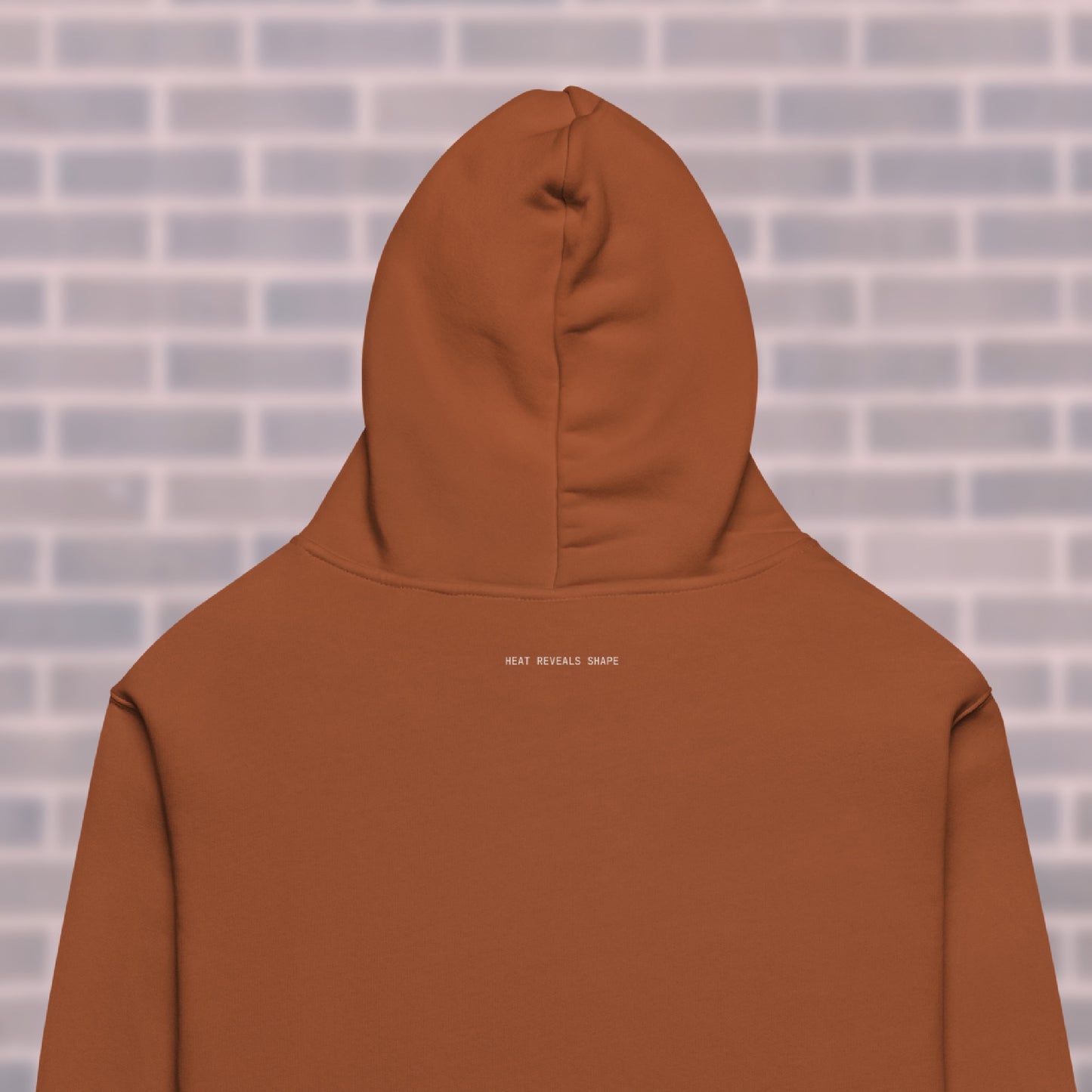 Clay CORE Hoodie back view with mantra “Heat Reveals Shape” — dancers & rollerskaters