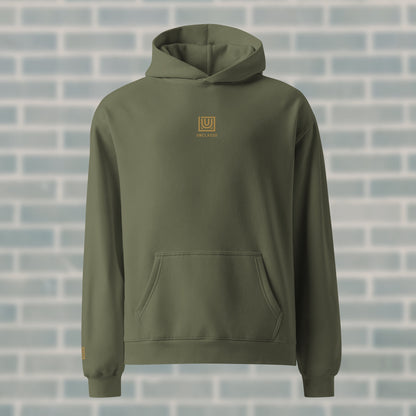 UNCLASSD Cypress Hoodie — premium oversized dance hoodie with centered gold embroidery and “GROUND MOVEMENT, GROUND MIND” mantra. Designed for dancers, rollerskaters, and movement training.