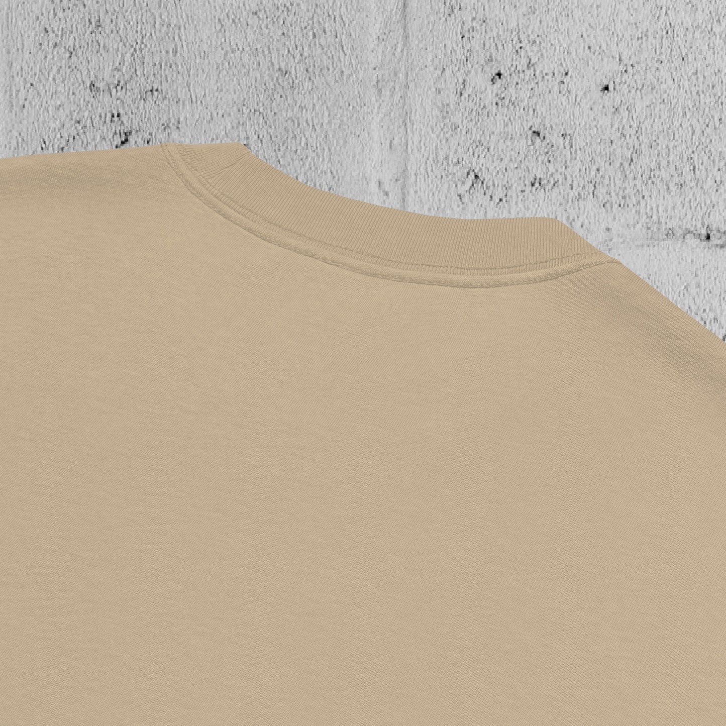 Close-up of wide ribbed neckline on the UNCLASSD CORE Oversized Tee, faded khaki, showing construction and finish.