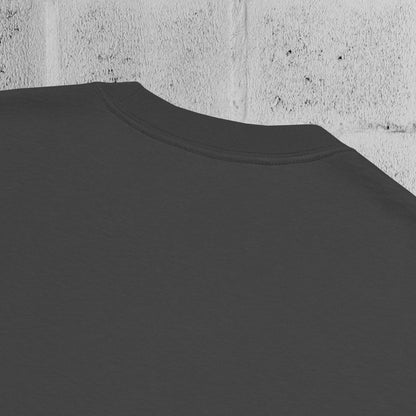 Close-up of heavyweight 240gsm cotton texture from the UNCLASSD CORE Oversized Tee, garment-dyed surface.