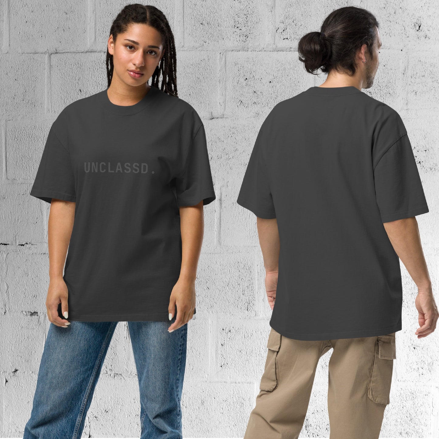 Model wearing the UNCLASSD CORE Oversized Tee in faded black, boxy streetwear fit designed for movement.
Back view of the UNCLASSD CORE Oversized Tee worn by model, showcasing garment-dyed cotton and relaxed shoulder line.