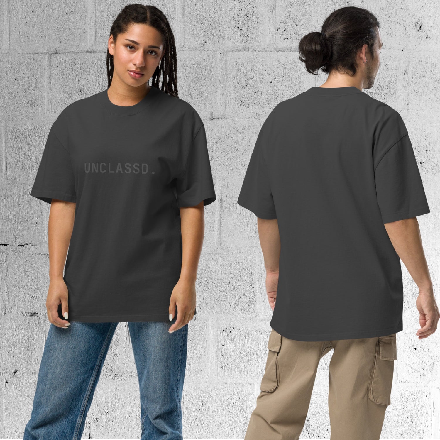 Model wearing the UNCLASSD CORE Oversized Tee in faded black, boxy streetwear fit designed for movement.
Back view of the UNCLASSD CORE Oversized Tee worn by model, showcasing garment-dyed cotton and relaxed shoulder line.