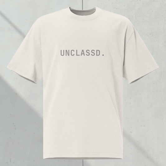 Front view of the UNCLASSD CORE Oversized Tee, bone color,  heavyweight 240gsm cotton, tonal chest print, boxy silhouette.