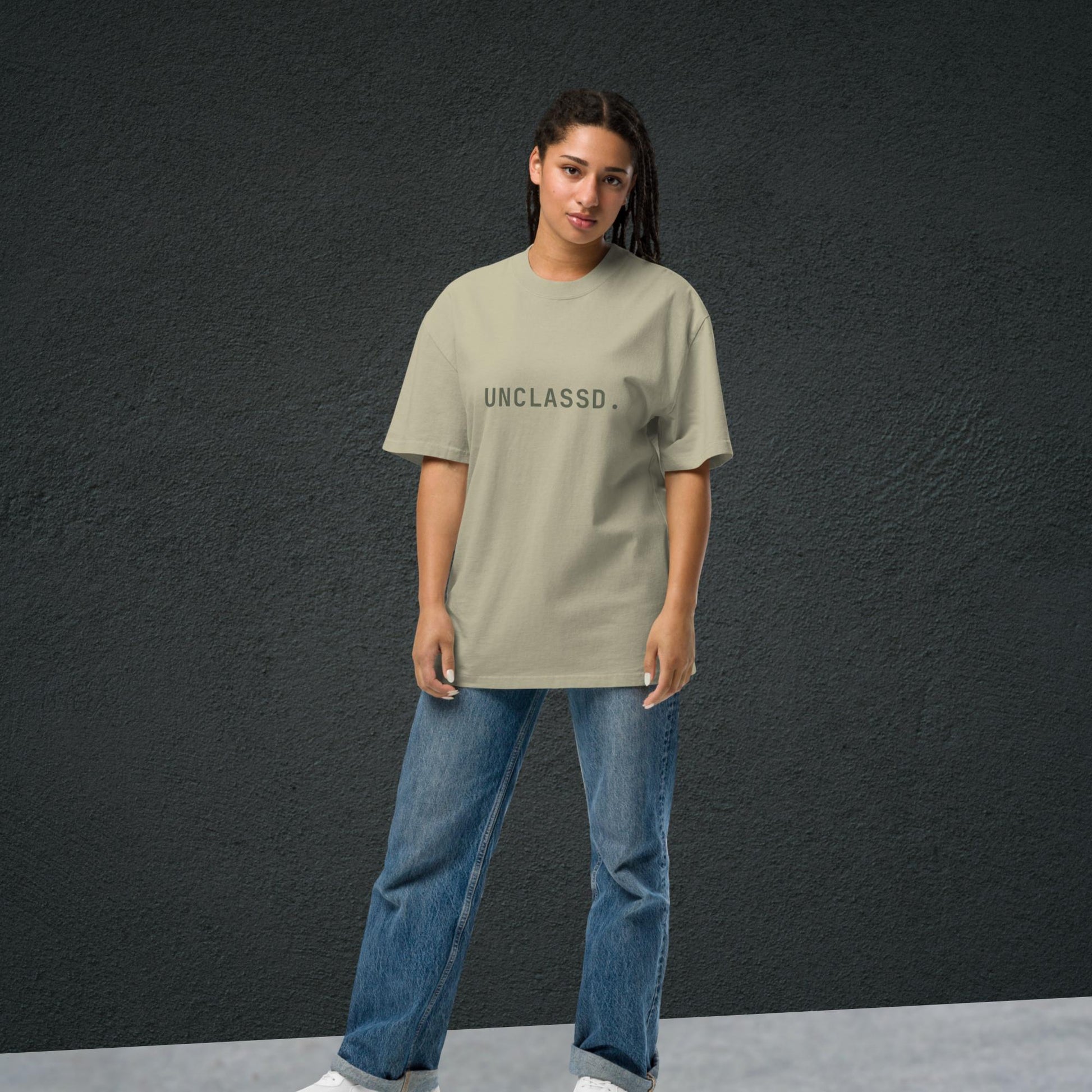Model wearing the UNCLASSD CORE Oversized Tee in faded eucalyptus sage, boxy streetwear fit designed for movement.