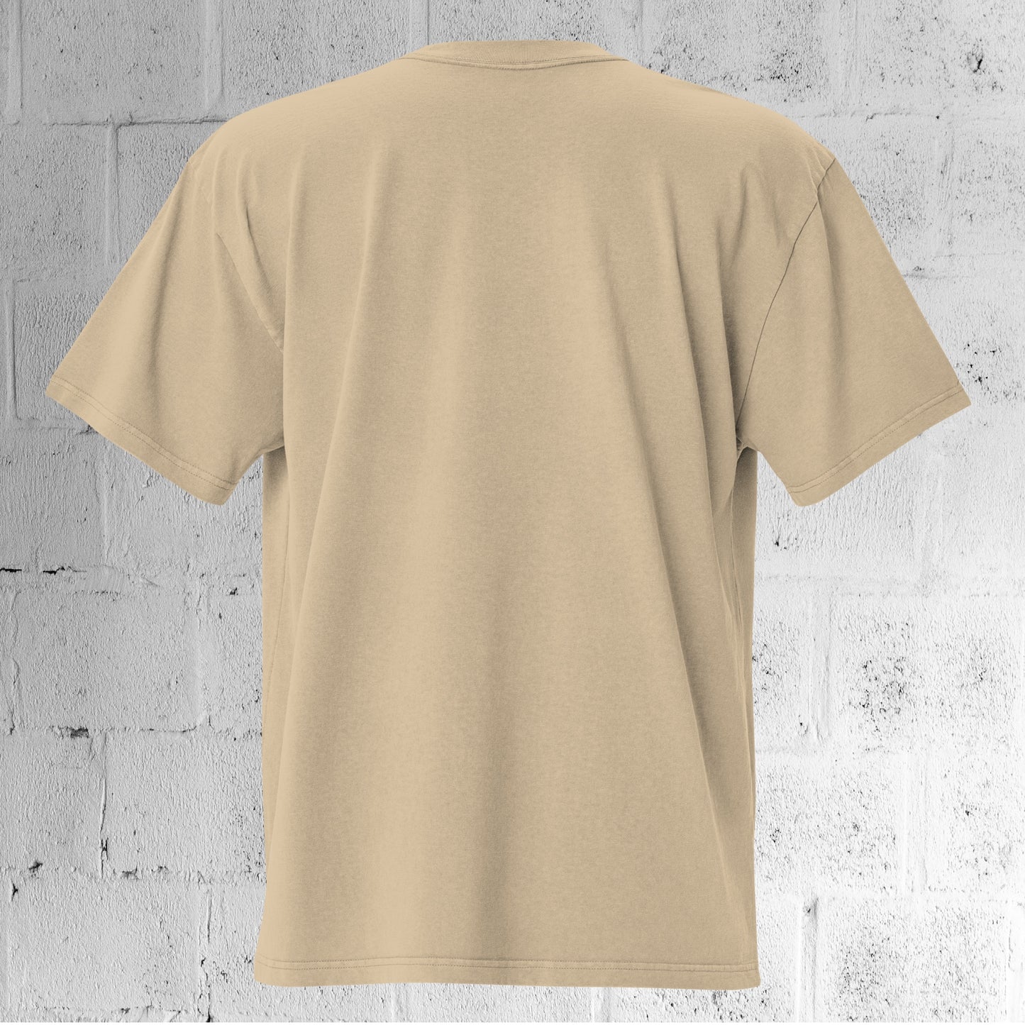 Back view of the UNCLASSD CORE Oversized Tee faded khaki/sand showing dropped shoulders and oversized fit.
