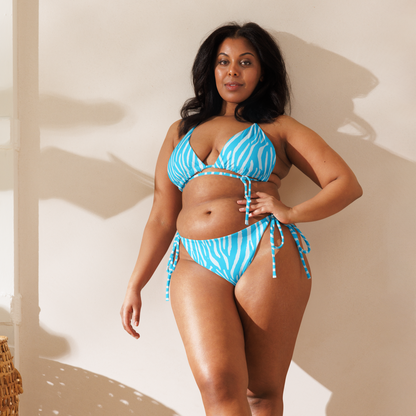 Woman wearing a neon blue zebra triangle bikini with adjustable tie straps by Unclassd.
